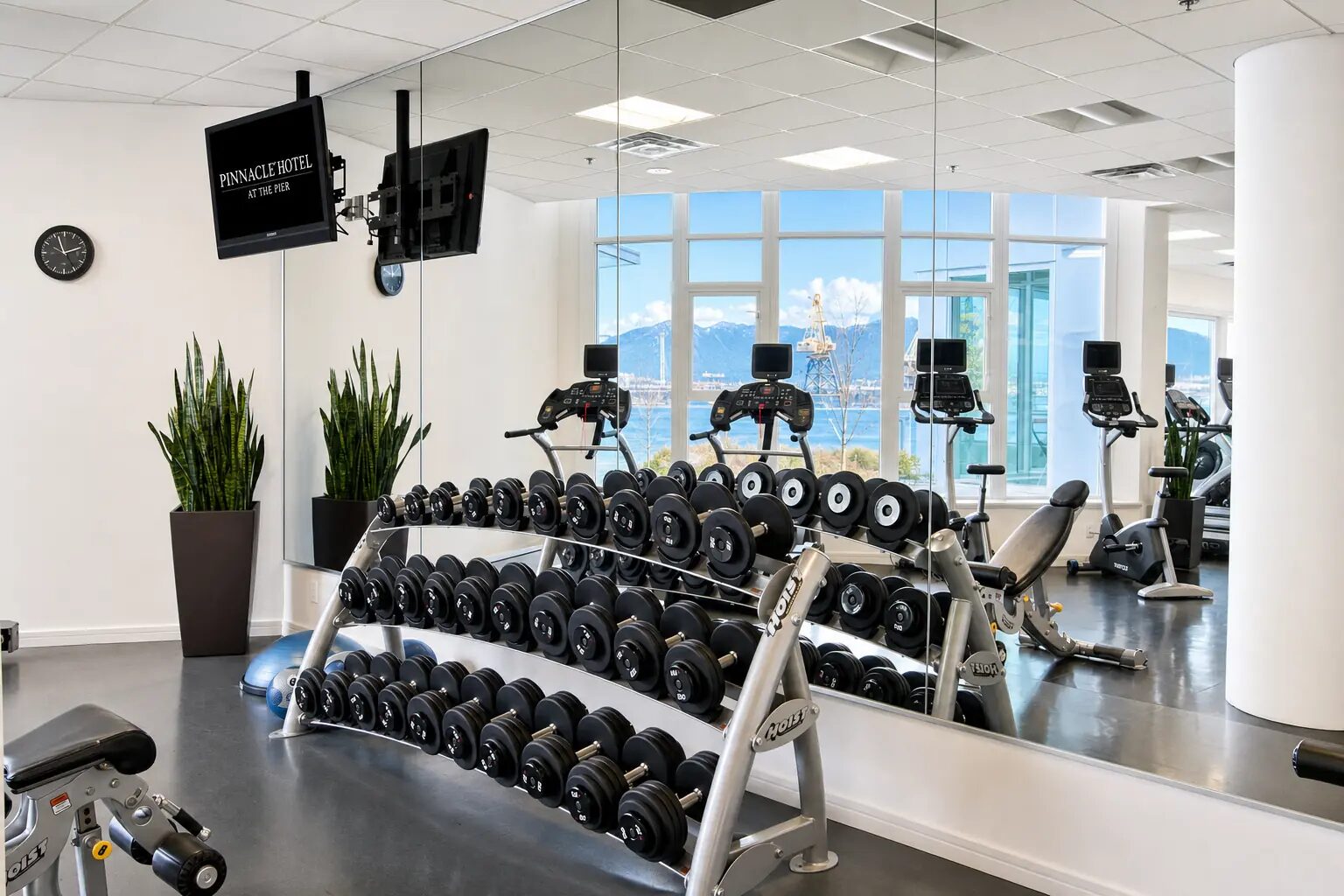 Pinnacle Hotel amenities — indoor lap pool and fitness centre